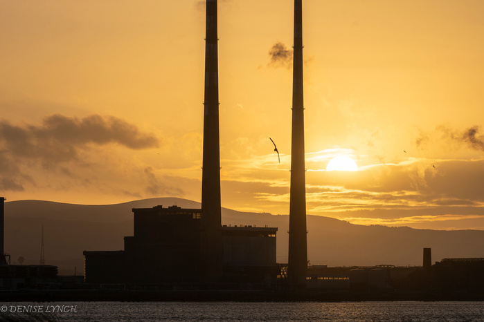 A view of the Poolbeg Chimneys at Sunset from the Wooden Bridge