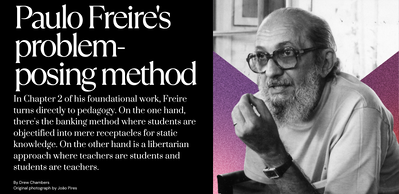 Black and white photo of Paulo Freire holding his hand up to make a point taken by João Pires. Text describing the thrust of Chapter 2 of Pedagogy of the Oppressed where Freire distinguishes between banking pedagogy and problem-posing pedagogy. 