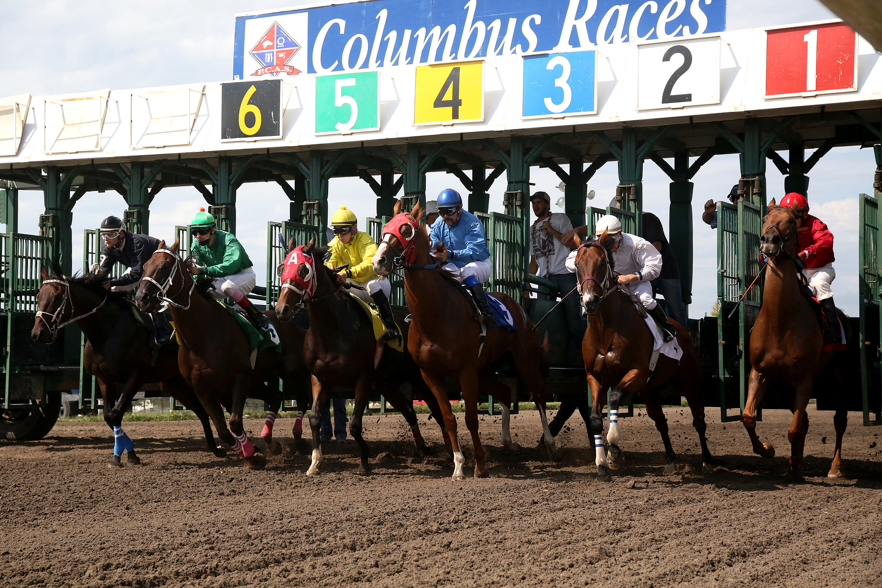 COLUMBUS, NEB - 9/6/2015 - The third race of the day at AG Park is off. With the push of a button from the starter the horses are released from the gates as the gate operators look on. JENNA VONHOFE/Lincoln Journal Star
