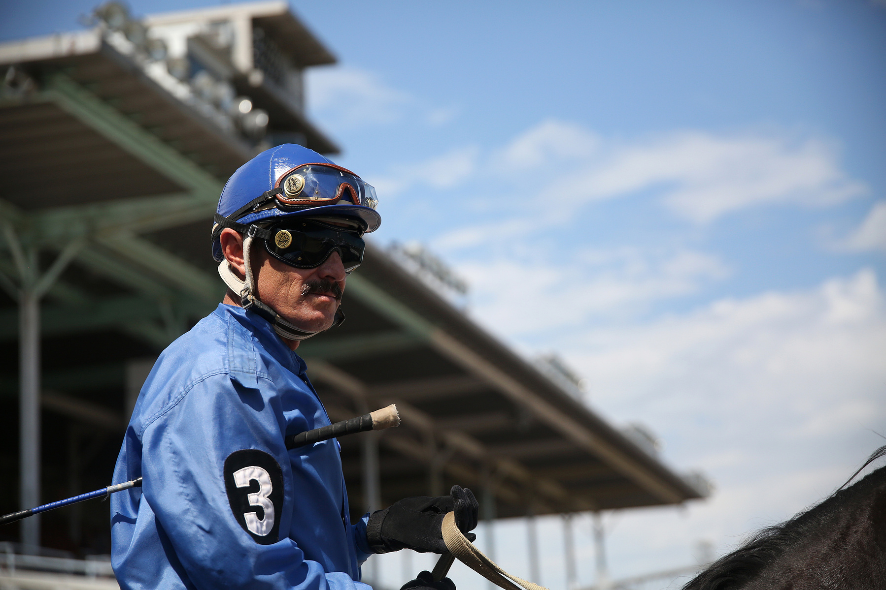 COLUMBUS, NEB - 9/6/2015 -Jockey Armando Martinez riding Baby Mamita in the third position is lead onto the race track at AG Park on Saturday, September 6, 2015. JENNA VONHOFE/Lincoln Journal Star