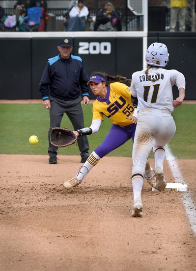 Mizzou catcher Julia Crenshaw, right, tries to beat out a grounder as LSU first baseman Raeleen Gutierrez catches the throw for an out Sunday at Mizzou Softball Stadium.