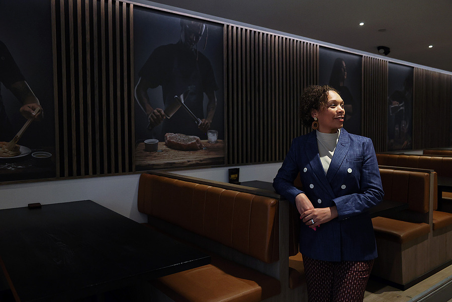 Cheyenne Tyler, executive director of Café Momentum's Pittsburgh location, poses for a portrait on April 10 at the group's Downtown restaurant. Tyler was appointed to Allegheny County's Juvenile Detention Board of Advisors. (Photo by Anastasia Busby/Publi