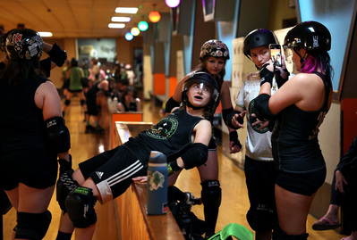 Ace Blackwell, second from right, with his friends and roller derby teammates on Oct. 8, at the Neville Roller Dome on Neville Island. (Photo by Anastasia Busby/PublicSource)