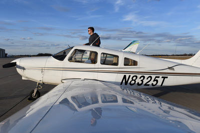 Nate Pfenenger finishes his pre-flight checklist during his flight lessons with his instructor John Morgan on Friday, Feb. 23, 2024 at the Jet Center in Columbia. He is going to the University of Missouri in the Fall to study Business.