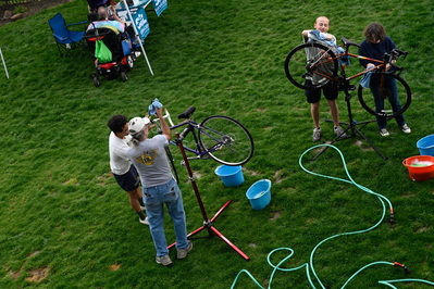 From left, Faizal Glenn, Kurt Mirt, Silas Smith and Merrill Sapp wash bikes on Tuesday, May 14, 2024, at Logboat Brewing Co. in Columbia. It was the first time they each volunteered with Local Motion.