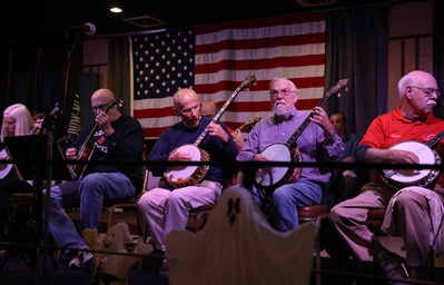 The Pittsburgh Banjo Club performs on Wednesday, Oct. 23, 2024, at the Elks Lodge, in North Side. The groups mostly plays songs from the 1920s. (Photo by Anastasia Busby/PublicSource)