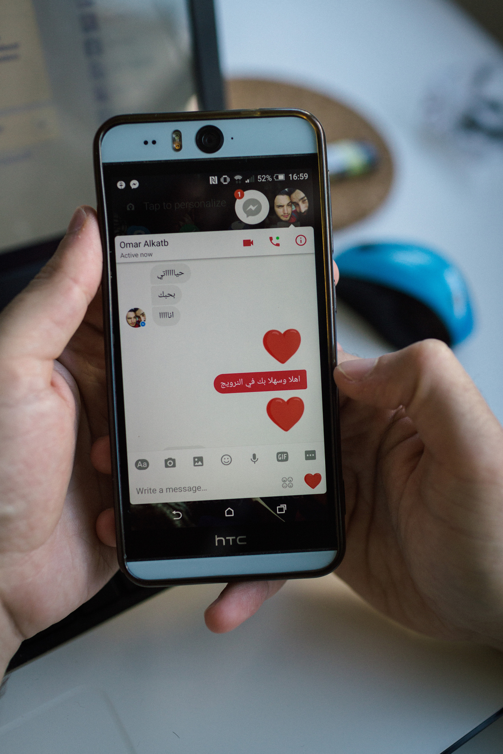 Nader chats with his fiancée Omar, as Omar tells Nader he's arrived in Norway. Text reads: Omar - "My darling, I love you." Nader - "Welcome to Norway"