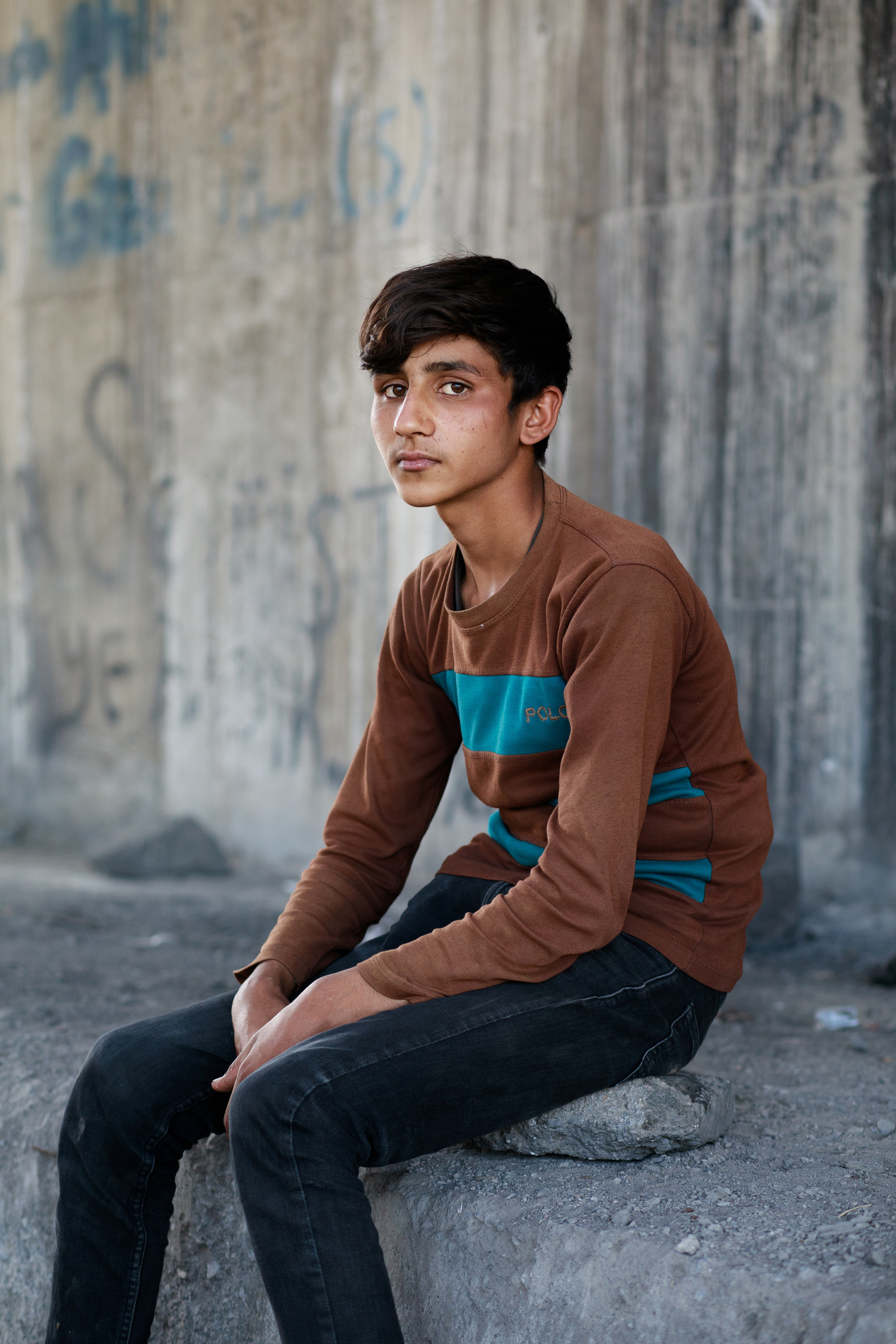 13 year old Sharzad, from Jalalabad, eastern Afghanistan, sitting under a road bridge in the city of Tatvan, where he has slept the past few nights, out of sight from the Turkish authorities.