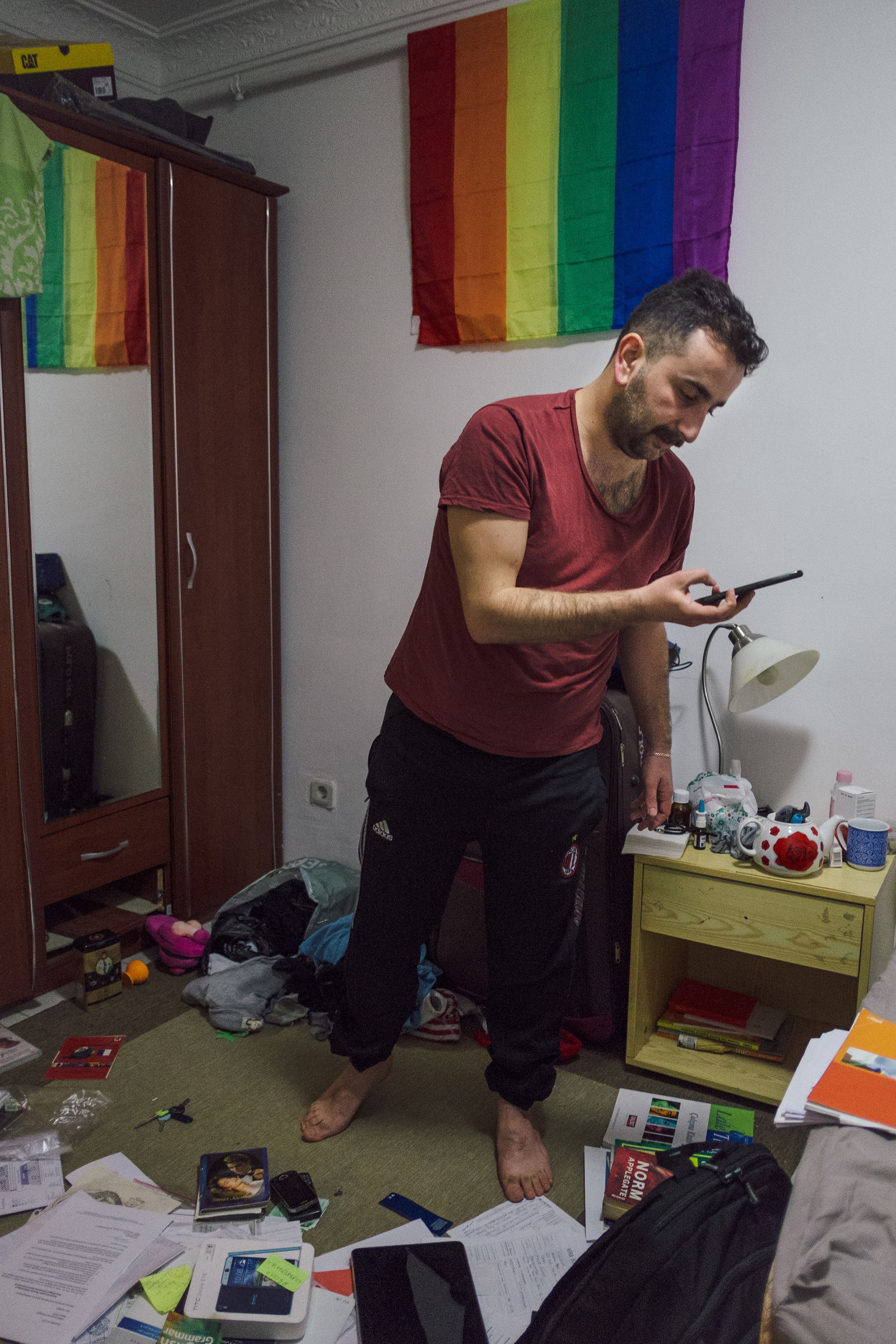 Nader, a gay man from Homs, Syria, packs his belongings at home in Istanbul, Turkey, on the eve of his departure to Norway after being granted political asylum. He will leave behind his job, his friends and his fiancé, Omar.