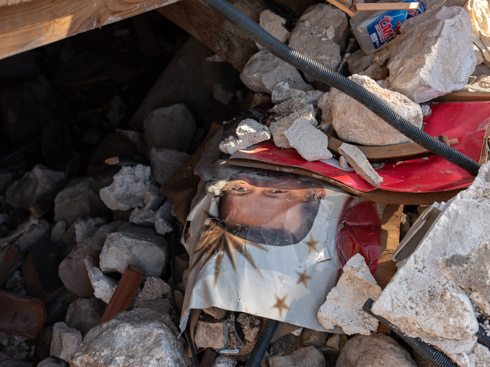 A photograph of Turkish president Recep Tayyip Erdoğan and a Turkish flag, saved from the rubble of a former home destroyed by the earthquakes in central Antakya, southern Turkey.