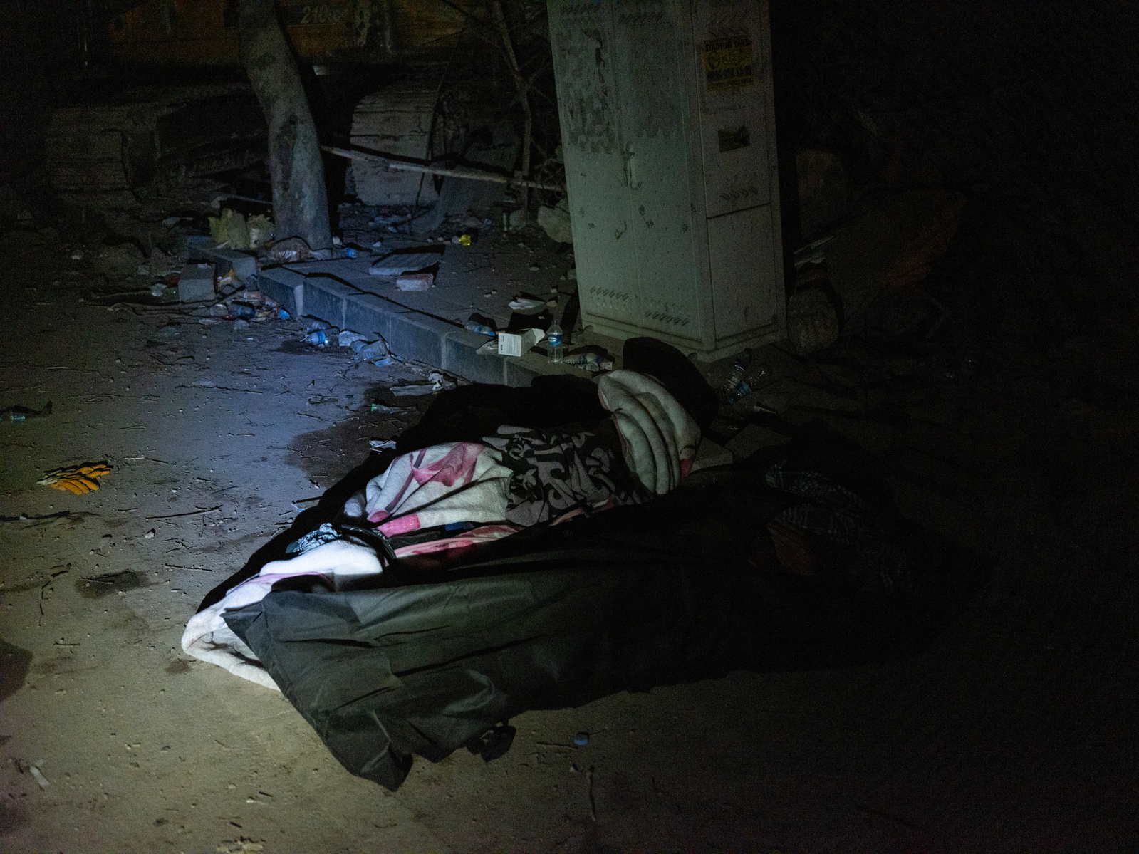 The bodies of two victims of Monday’s earthquake lay on the side of the road at night, alongside hundreds of others in Antakya, Turkey, where severe devastation was caused by the two large earthquakes on the 6th of February 2023.