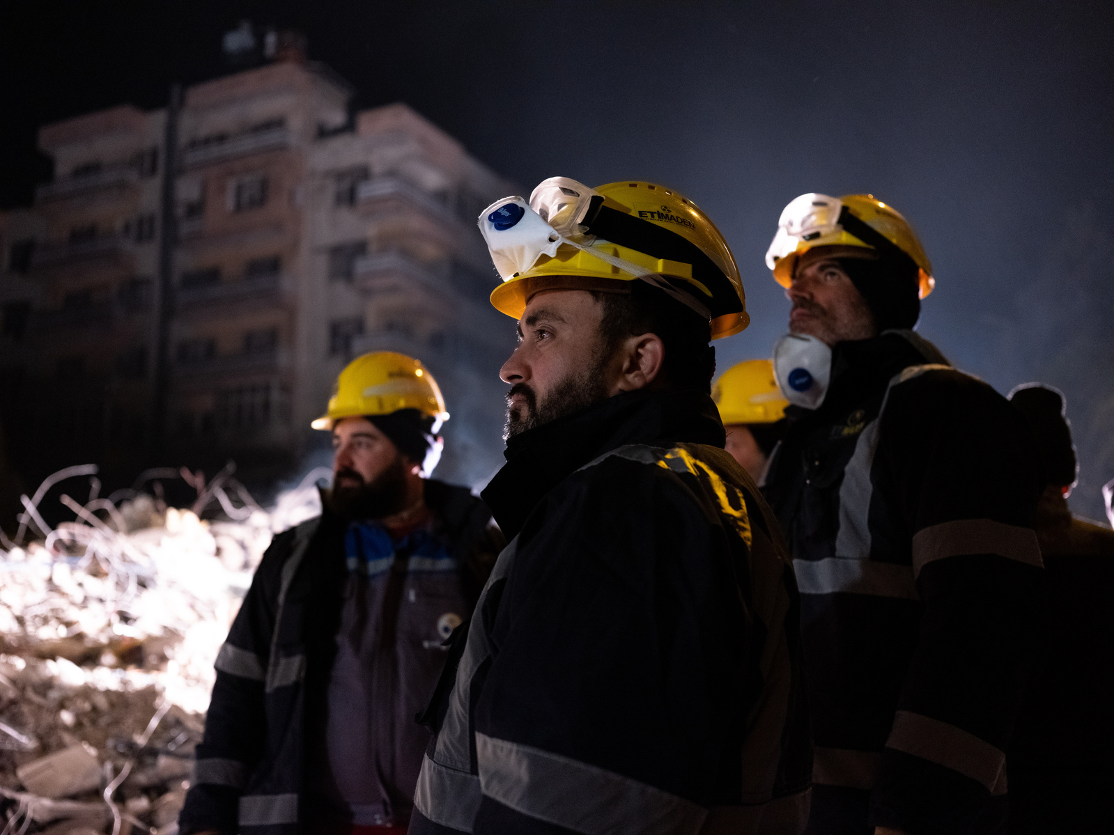 Miners who volunteered to help with the rescue effort to find survivors, survey the extent of the damage caused by the two large earthquakes which struck in southern Turkey.