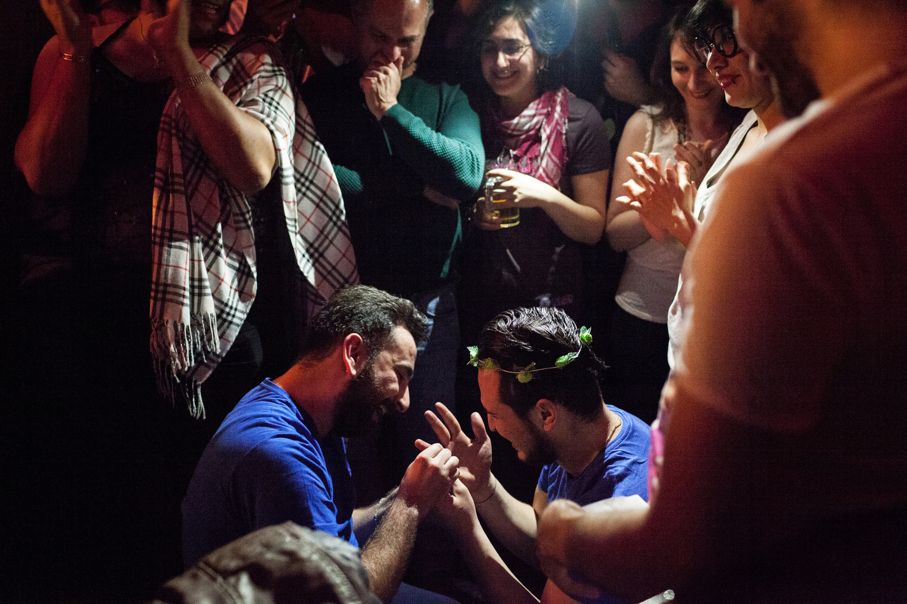 Nader (left) puts a ring on Omar's (right) finger after he accepted Nader's marriage proposal during Omar's birthday party in Istanbul, Turkey