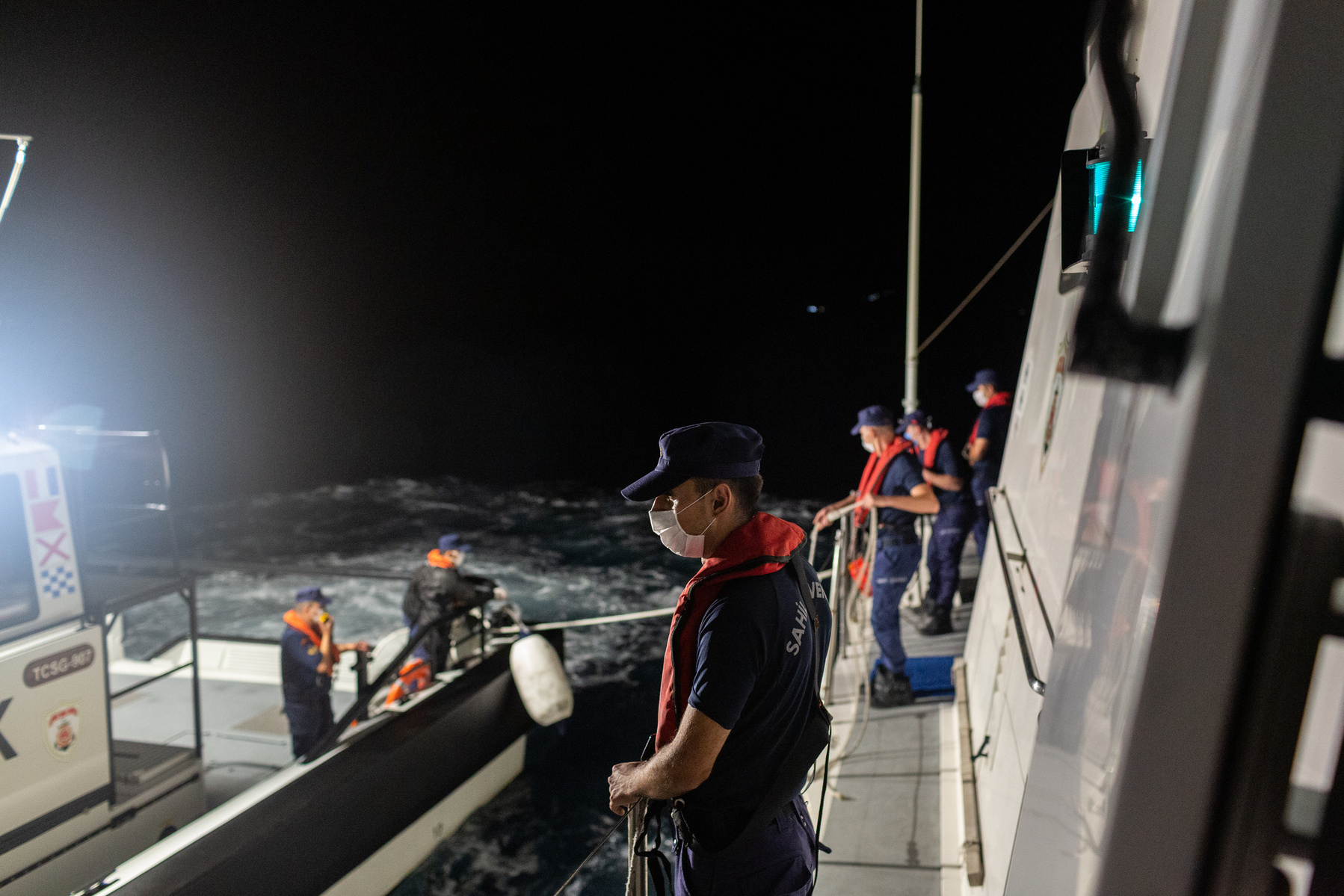 Europe, Turkey, northern Aegean Sea. Turkish coastguard prepare for a rescue operation of migrants drifting in the open water at night, using thermal imaging cameras to help locate them.