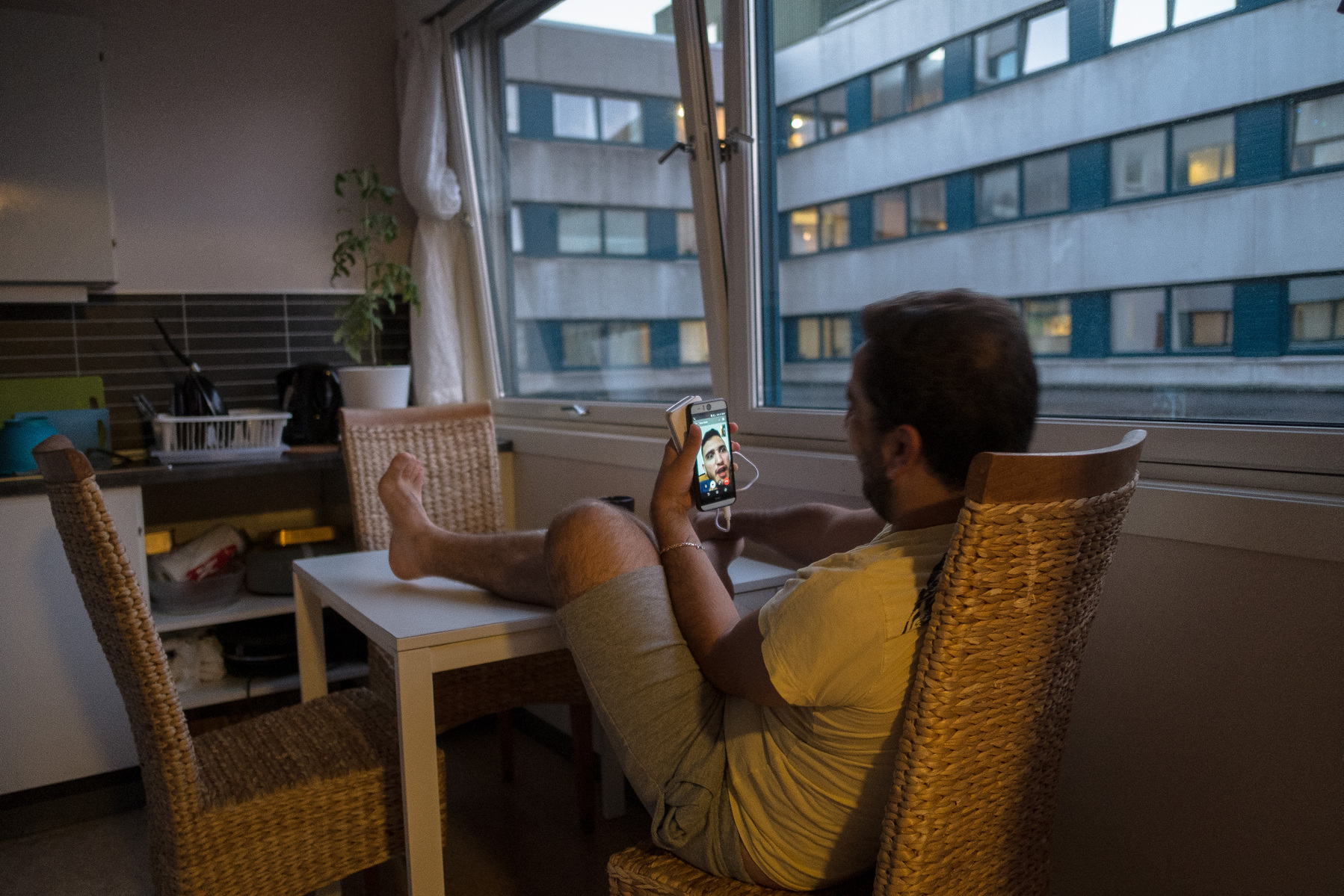 The evening before Omar is due to arrive in Norway, him and Nader video chat with each other by phone. Omar will leave for Istanbul's airport in a few hours, and he's both excited and nervous about flying to a new life in northern Europe.