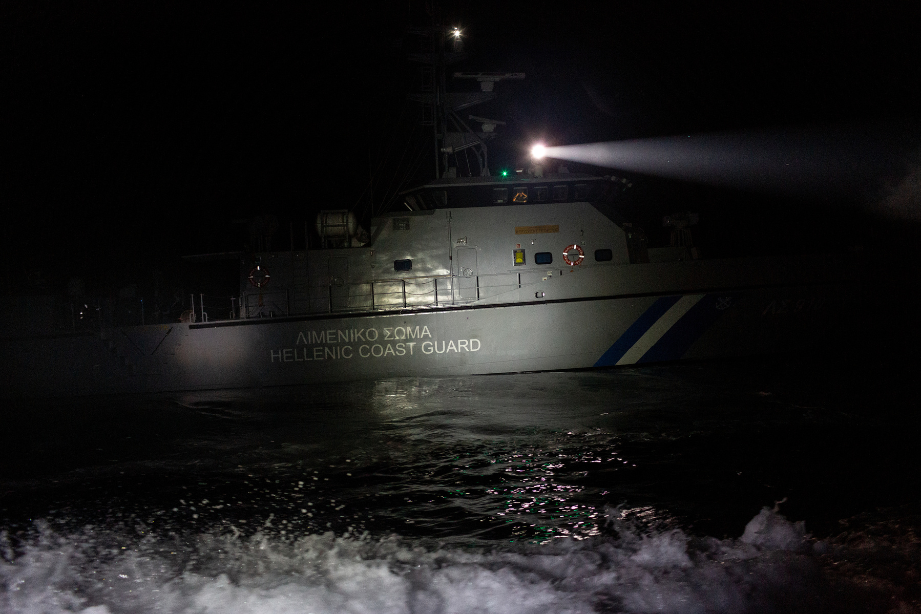 Northern Aegean Sea. Hellenic (Greek) Coastguard boat LS910 in the early hours of the morning, near the site where two flimsy rafts with a total of 20 Afghan citizens on board, were rescued by the Turkish coastguard. The Greek coastguard claim they were i