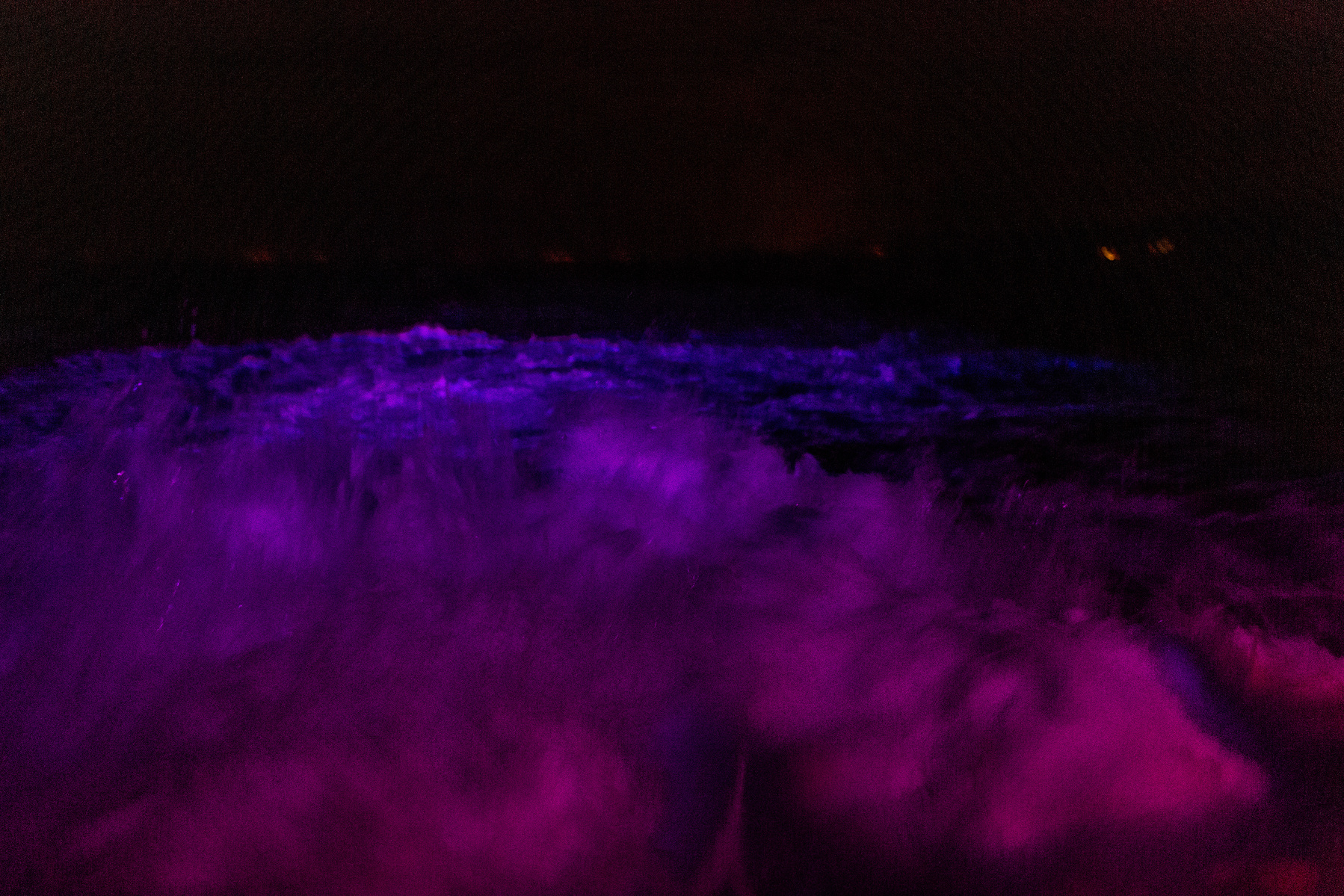 The waters of the northern Aegean Sea are lit by the lights on a Turkish coastguard boat en route to a rescue operation in the early hours of the morning.