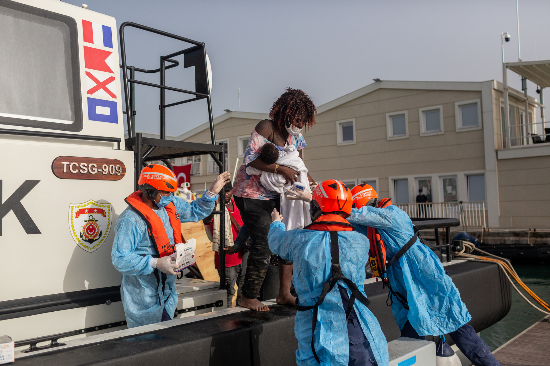 Europe, Turkey, Kusadasi. 38 migrants disembark a Turkish coastguard ship which rescued them after 17 hours drifting at sea, between Turkish and Greek waters in the northern Aegean Sea. The boat was forcible pushed back into Turkish waters, and the migran