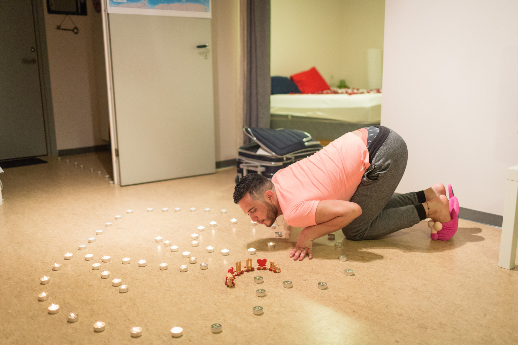 Omar blows out the candles shaped in a heart and the letters O and N, for Omar and Nader, which Nader had set up prior to picking Omar up from the airport in Bergen, Norway. The couple will share Nader's apartment for the first few months until a larger p