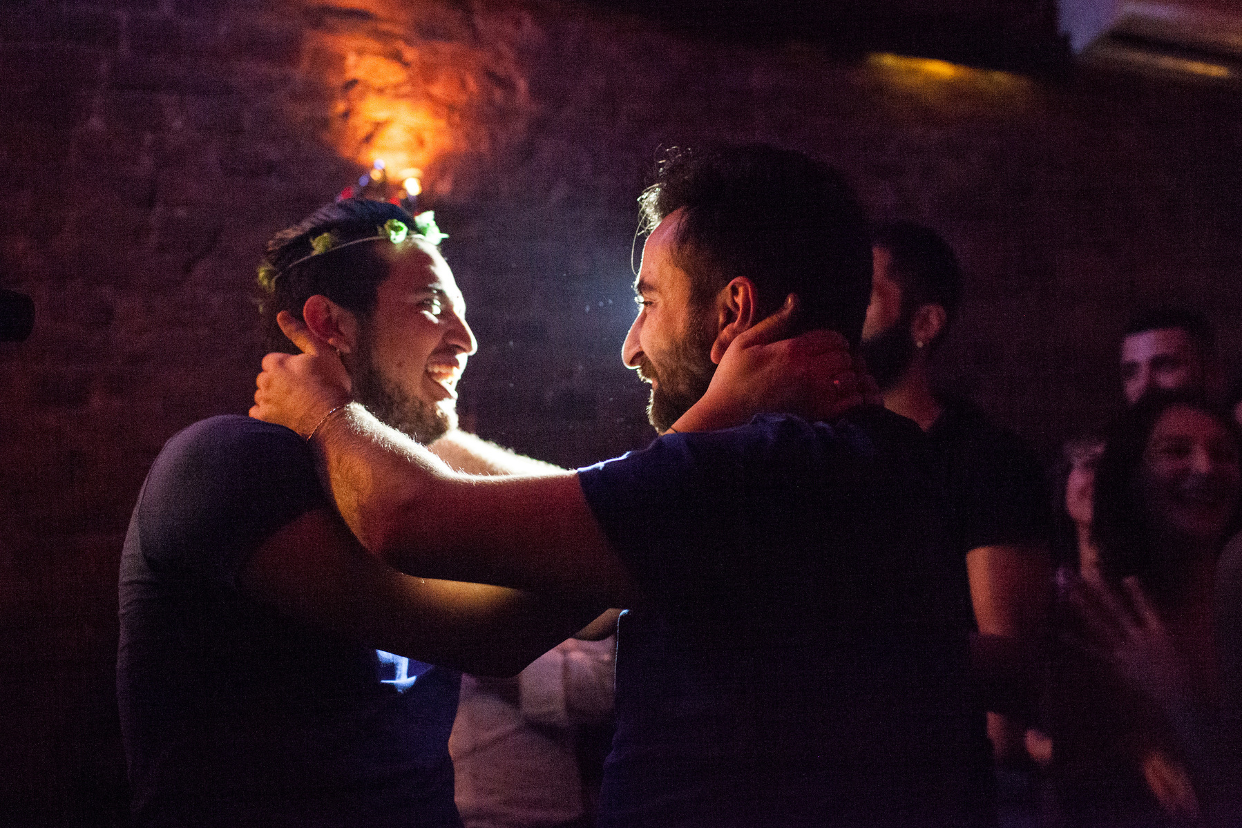 Omar (left) and Nader (right) hold each other after Omar accepted Nader's marriage proposal during Omar's birthday party in Istanbul, Turkey