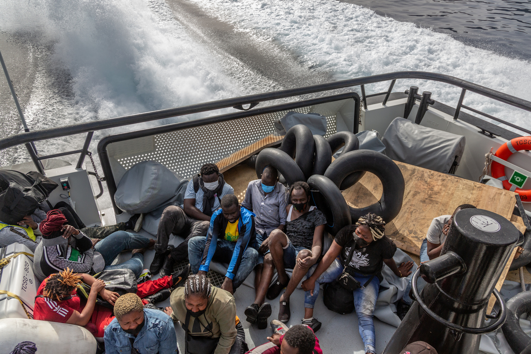 Europe, Turkey, Northern Aegean Sea. 38 migrants and asylum seekers from various sub Saharan African countries on a Turkish Coastguard boat, after being rescued. They were drifting at sea for at least 17 hours, and all claim to have been attacked by Greek