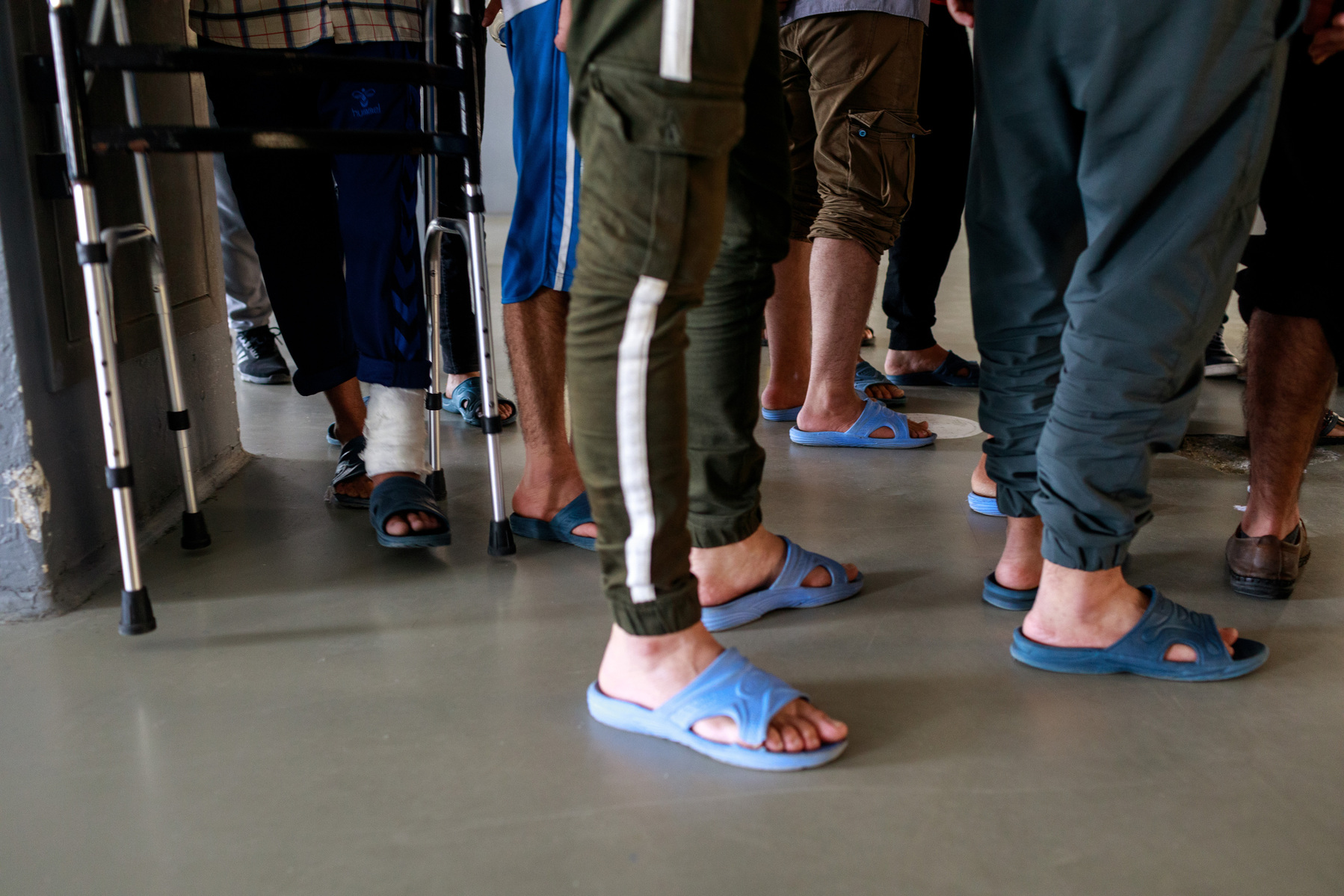 Turkey, Van. Afghan migrants at an immigration deportation removal centre near Van city, queue for lunch in the cantine. As the Taliban have taken control of Afghanistan, deportations are no longer taking place from Turkey, although they may continue in t