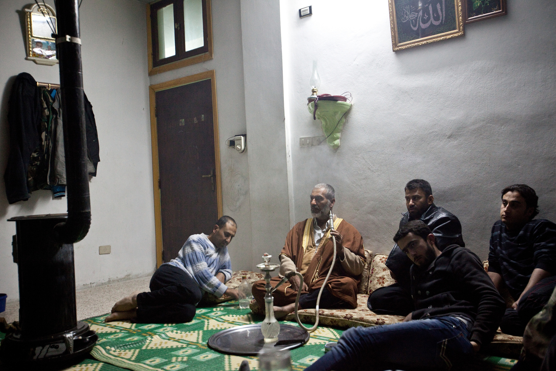 Villagers in Adthar, Idlib discuss the security problems in their area. 18/11/2012. Adthar, Idlib, Syria