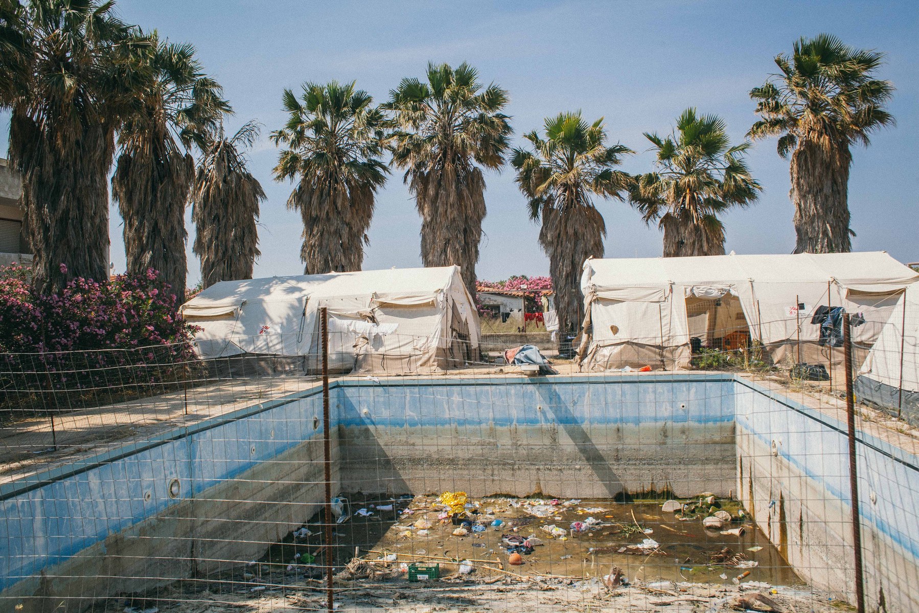 The area around the swimming pool of the Hotel Captain Elias on the Greek island of Kos has become a home to the hundreds of irregular migrants arriving from Turkey each day, before they move onwards to Athens.