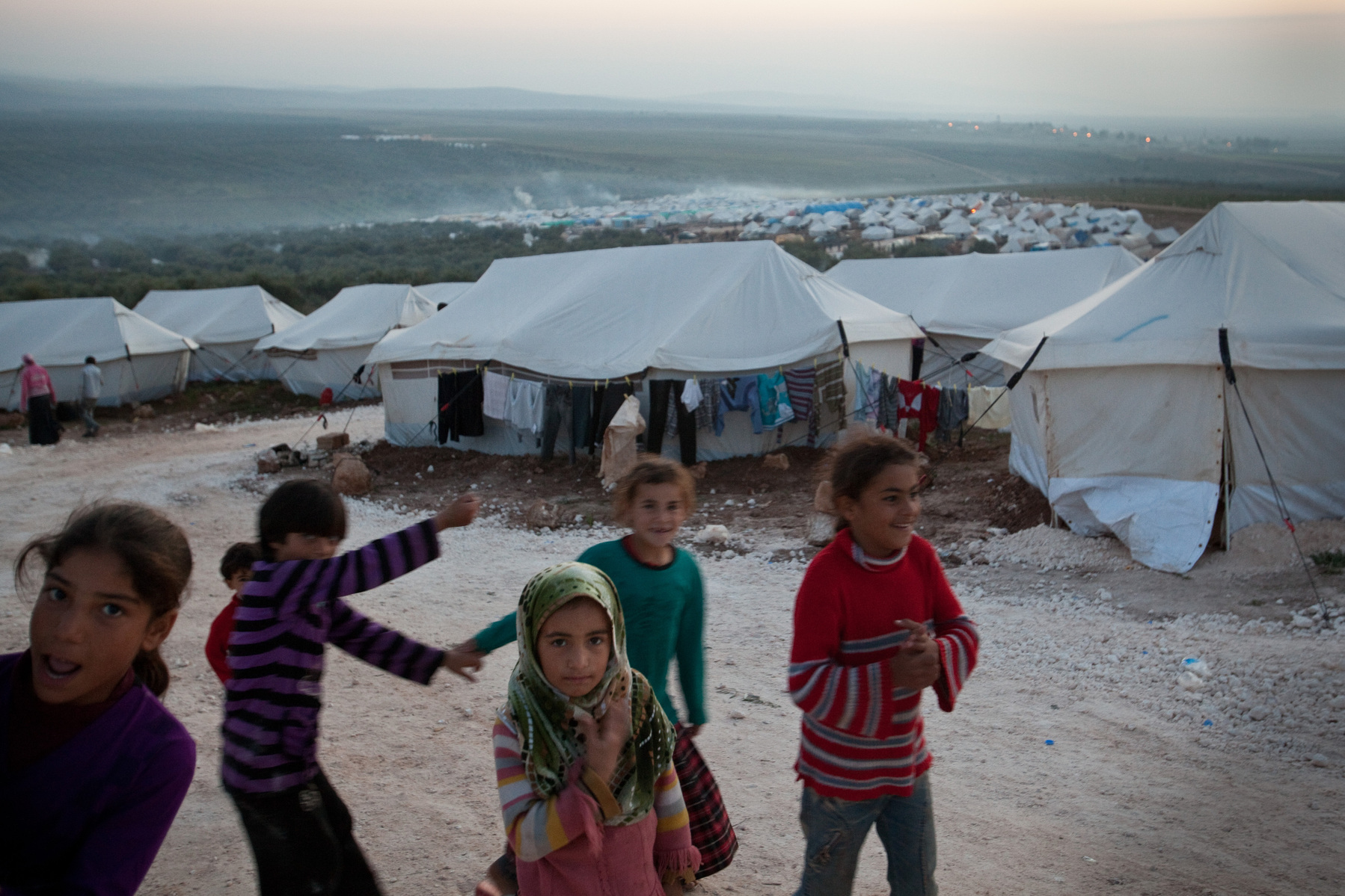 Syrian girls play in Atmeh refugee camp, for internally displaced Syrians. Around 12,000 IDP now live in the camp. December 2nd 2012, Atmeh, Syria.