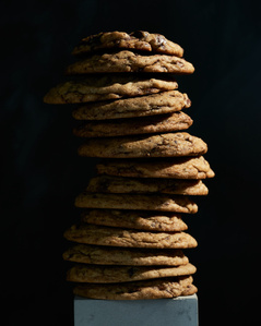 stack of chocolate chip cookies, food photography, moody food photography, conceptual food photography