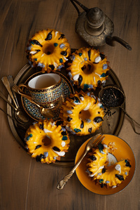 gold teacup and golden bundt cakes