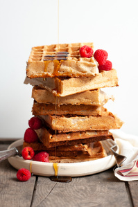 sourdough waffles in a stack with raspberries