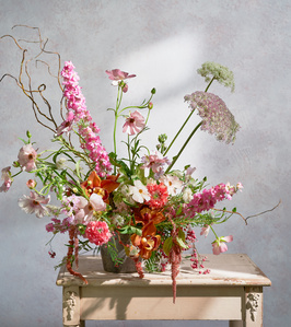 whimsical floral arrangement with window shadow