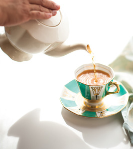 afternoon tea art deco teacup pouring teapot