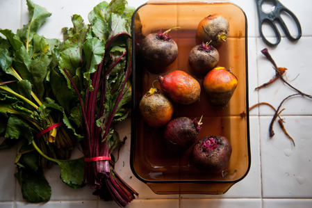 beets beet tops scissors white tile in kitchen