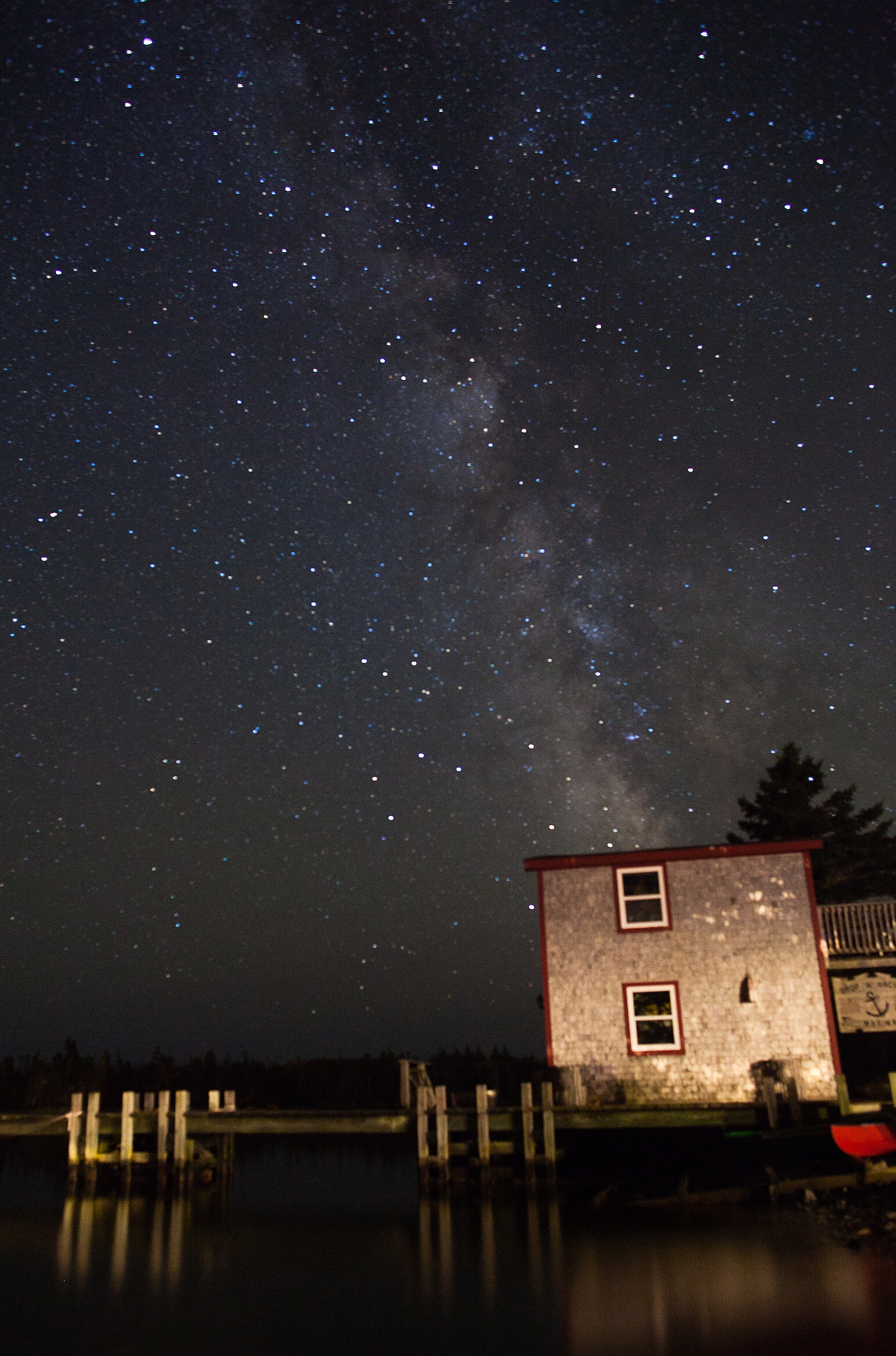 Milky Way hangs over boat house in Nova Scotia.