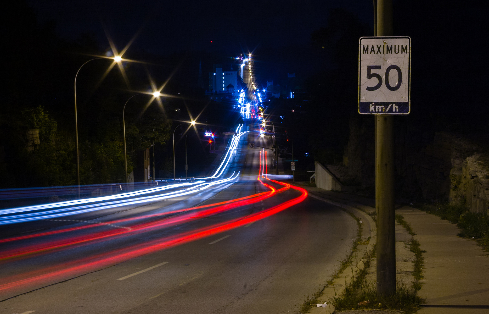 Car light trails drive down a hill in Owen Sound.