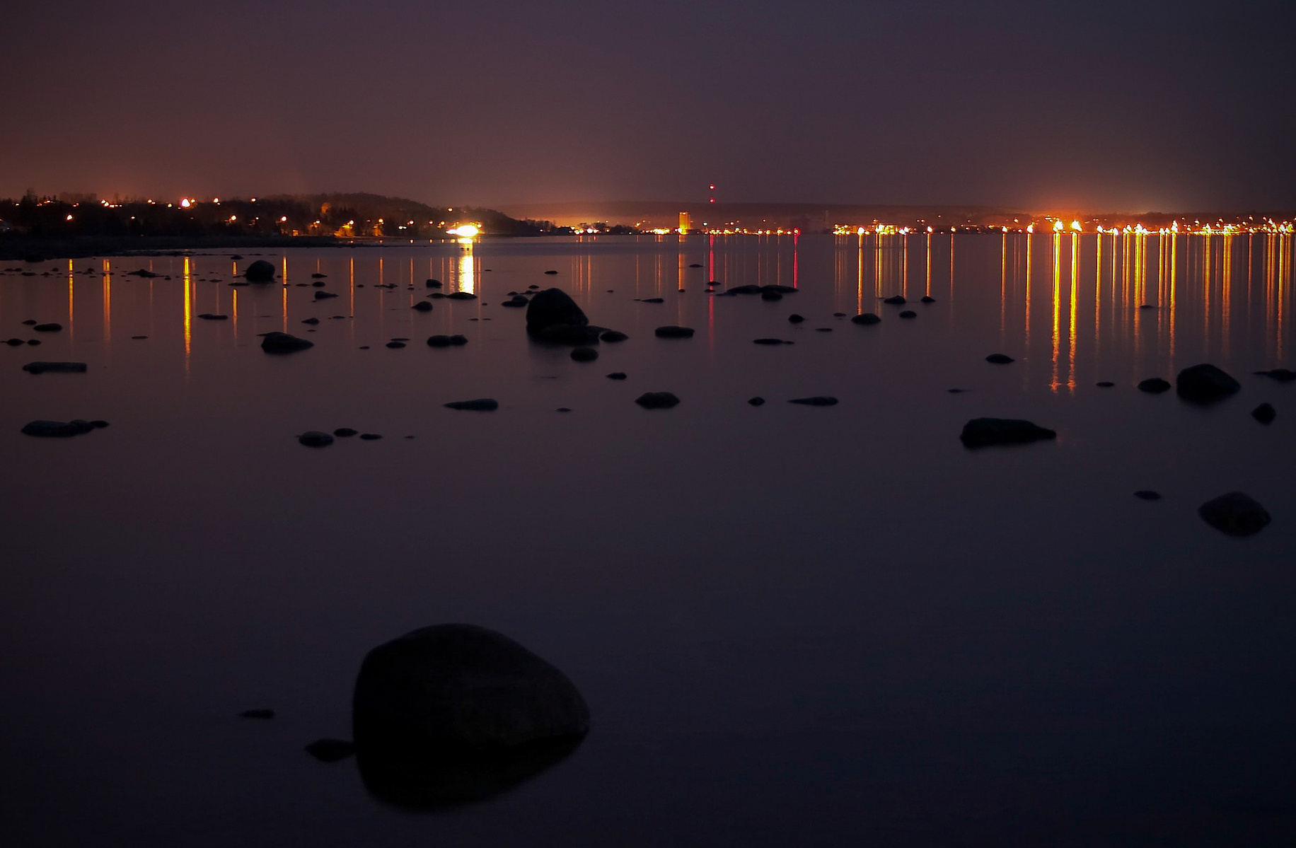 The lights of Owen Sound reflected in Georgian Bay.