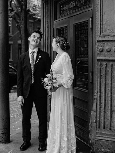 Candid moment of bride and groom in New York City — CT-based wedding photographer.