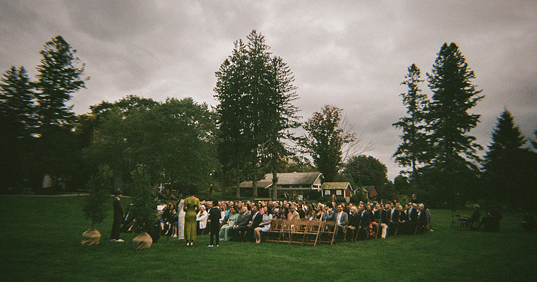 Moody wedding ceremony captured on 35mm Ilford Sprite film, showcasing intimate moments on a cloudy day, photographed by a Connecticut wedding photographer.