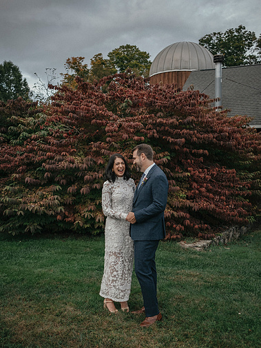Couple at Winvian in Litchfield, Connecticut with vibrant fall foliage in the background — captured by a CT-based wedding photographer.