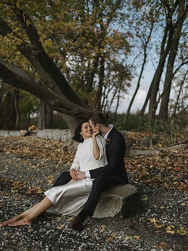 Elopement couple looking at each other in the Hudson Valley and NYC with fall colors — captured by a CT-based wedding photographer.
