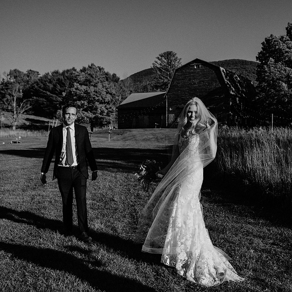 Black and white photo of bride and groom laughing at Hayfield wedding in the Catskill Mountains by Connecticut wedding photographer.