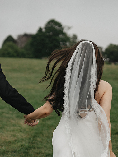 Bride and groom running together at Harkness State Park in Waterford, Connecticut — photographed by a CT-based wedding photographer.