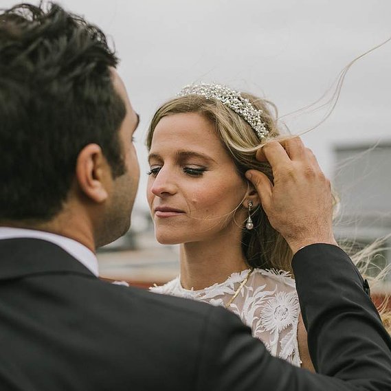 Soft touch of the groom’s hand on the bride, captured by a Connecticut wedding photographer.