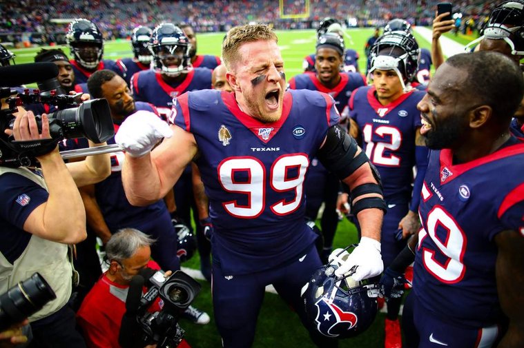This is an image of J.J. Watt in the huddle before a game shot by Houston Texans team photographer Zach Tarrant.