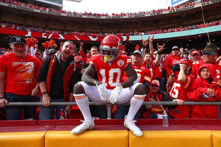 An image of Kansas City Chiefs wide reciever Tyreek Hill celebrating with fans shot by Chiefs team photographer Steve Sanders.