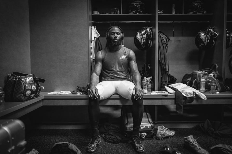 An image of a Philadelphia Eagles player sitting in the locker room shot by photographer Kiel Leggere.