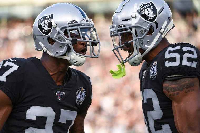 An image of two Raiders players celebrating shot by Las Vegas Raiders photographer Matt Aguirre.