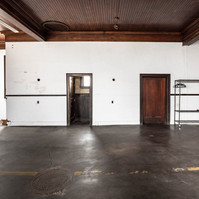 Interior view of photography and videography studio Enginehouse 27 located in Detroit, MI available for daily rental which includes, grip, lighting, capture cart, camera stand, lounge, generous space.